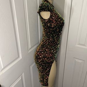 Mock neck with a split thigh & cut out side, size Small, & multicolored.